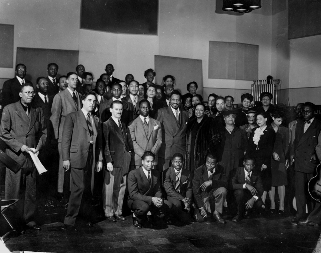 Front row standing (L-R): Hall Johnson, Alan Lomax, D. G. Bridson, Canada Lee, Paul Robeson, Ethel Waters.